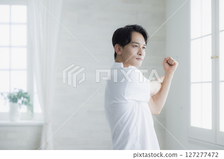 A man stretching 127277472