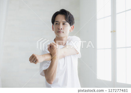 A man stretching A man stretching 127277481