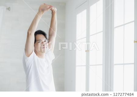 A man stretching A man stretching 127277484