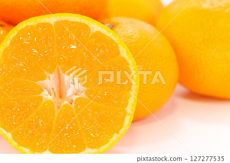 Arita mandarin oranges, cut, cross section, light background Arita mandarin oranges, cut, cross section, light background 127277535