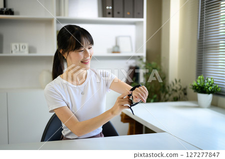 Asian woman check up low blood pressure with digital pressure monitor, Home nurse concept 127277847