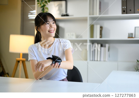 Asian woman check up low blood pressure with digital pressure monitor, Home nurse concept Asian woman check up low blood pressure with digital pressure monitor, Home nurse concept 127277863