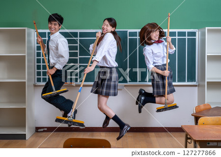Enjoy School Life: Young people enjoying student life, high school students, cleaning, playing music, imitating a band with cleaning equipment 127277866