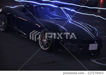 sleek black sports car 127278453