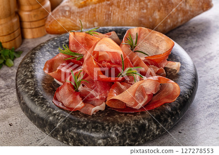 Spanish dry jamon serrano pork meat slices Spanish dry jamon serrano pork meat slices 127278553