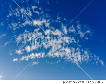 The sky is blue with a few clouds scattered throughout 127279017