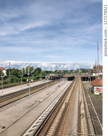 A train station with a long track of train tracks 127279021