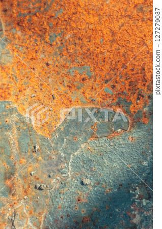 The image is of a rusty surface with a blue and orange color scheme 127279087