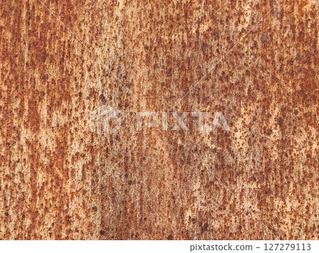 A rusty surface with many holes and a rough texture 127279113