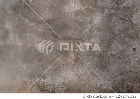 A grey wall with cracks and holes A grey wall with cracks and holes 127279152