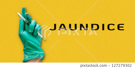 A person holding a syringe with the word Jaundice written below A person holding a syringe with the word Jaundice written below 127279302