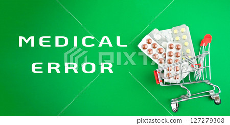 The cart is filled with pills and he is overflowing 127279308