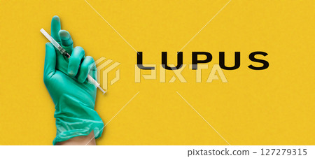 Person holding a syringe with the word Lupus written below Person holding a syringe with the word Lupus written below 127279315