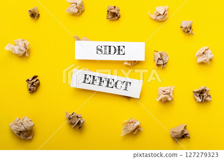 Yellow background with two pieces of paper on it 127279323