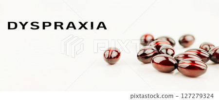 Close up of red pills with Dysproxia written in white letters 127279324