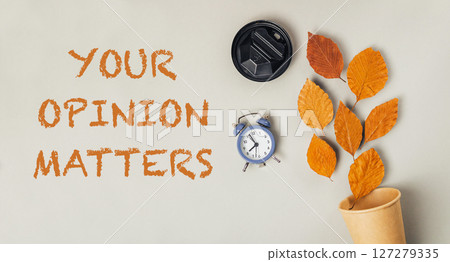 Clock and leaves are on a white background with the words Your Opinion Matters Clock and leaves are on a white background with the words Your Opinion Matters 127279335