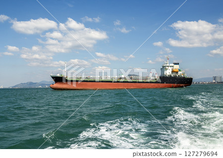 Oil tanker fleet used for transportation oil in blue sea. Transport for petroleum products, gas and oil under sanctions. Industrial landscape of petroleum logistics Oil tanker fleet used for transportation oil in blue sea. Transport for petroleum products, gas and oil under sanctions. Industrial landscape of petroleum logistics 127279694