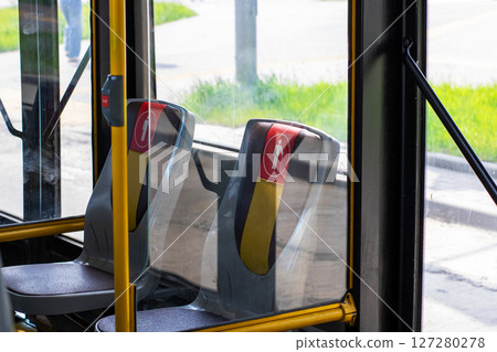 A bus featuring a prominent red button, clearly labeled as emergency 127280278
