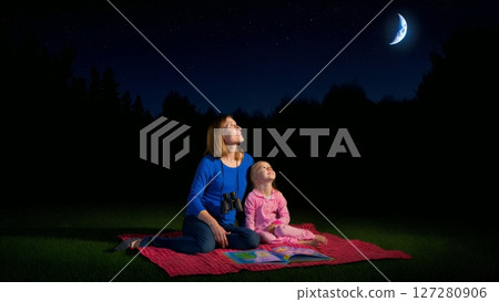 Mother and Daughter Stargazing Under Night Sky in Backyard Mother and Daughter Stargazing Under Night Sky in Backyard 127280906