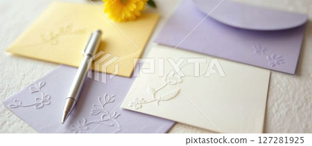 Elegant embossed floral stationery with pen and soft colors 127281925