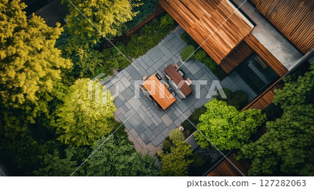 Elegant modern wooden house surrounded by lush greenery 127282063