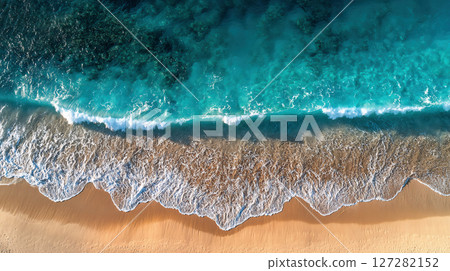 Aerial shot of a tropical beach with beautiful natural gradations created by the waves 127282152