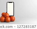 Display of Fresh Oranges Next to a Smartphone in a Virtual Shop Window for Online Shopping Experience 127283187