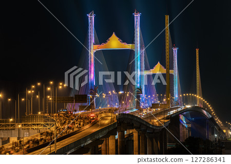 Thotsamarachan Bridge (Rama IX Bridge) crossing Chao phraya river. Beautiful city of Bangkok at night time. Thotsamarachan Bridge (Rama IX Bridge) crossing Chao phraya river. Beautiful city of Bangkok at night time. 127286341