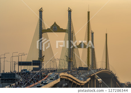 Bangkok, Thailand - January 17, 2025 : Thotsamarachan Bridge (Rama IX Bridge) crossing Chao phraya river. Beautiful city of Bangkok during sunset time. Bangkok, Thailand - January 17, 2025 : Thotsamarachan Bridge (Rama IX Bridge) crossing Chao phraya river. Beautiful city of Bangkok during sunset time. 127286344
