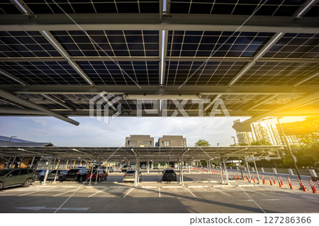 Solar Panel Photovoltaic installation on a Roof of car parking lot, alternative electricity source - Sustainable Resources Concept. Solar Panel Photovoltaic installation on a Roof of car parking lot, alternative electricity source - Sustainable Resources Concept. 127286366