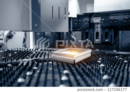 Automatic metal sheet bending machine at work in factory. CNC Panel Bender (Press Arm Type) 127286377