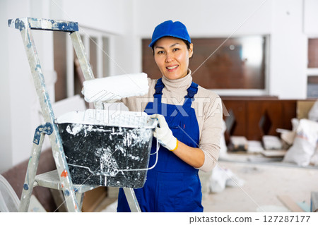 Asian woman builder looking at camera and smiling 127287177