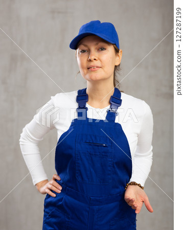 Smiling adult woman posing in uniform 127287199