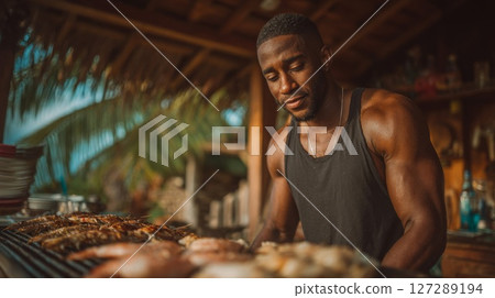 Muscular Man Grilling Seafood Outdoors 127289194