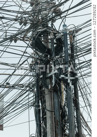Abstract background surface of bunch of wires connected on the pillars in Bali island, Indonesia Abstract background surface of bunch of wires connected on the pillars in Bali island, Indonesia 127289282