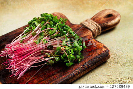 fresh micro-greens, beetroot sprouts, on a wooden chopping board, top view, no people, fresh micro-greens, beetroot sprouts, on a wooden chopping board, top view, no people, 127289489