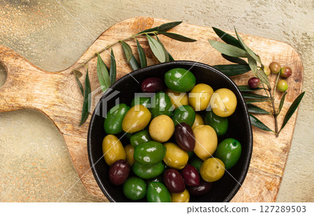 a mixture of olives, varieties of chalkidiki, Verdi giganti and Kalamata, in a bowl, top view, no people, a mixture of olives, varieties of chalkidiki, Verdi giganti and Kalamata, in a bowl, top view, no people, 127289503