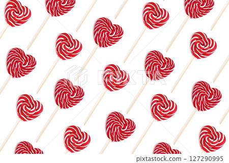 Pattern from heart lollipops candy on a stick 127290995