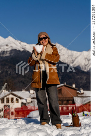 Snow Woman Mountains Winter: Heart-shaped snow, sunny Alps village, joyful winter activity. Snow Woman Mountains Winter: Heart-shaped snow, sunny Alps village, joyful winter activity. 127291094