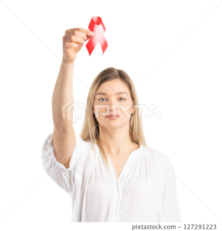 Woman holding red ribbon as symbol of HIV AIDS awareness Woman holding red ribbon as symbol of HIV AIDS awareness 127291223
