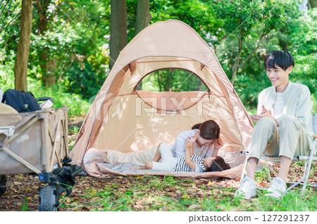 Family enjoying camping in the great outdoors 127291237
