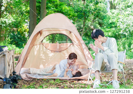 Family enjoying camping in the great outdoors Family enjoying camping in the great outdoors 127291238