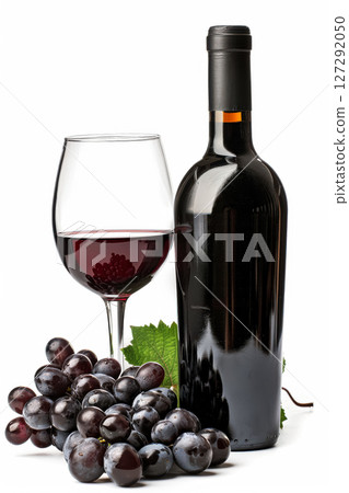 Bottle of wine and a glass of wine are on a table with a bunch of grapes Bottle of wine and a glass of wine are on a table with a bunch of grapes 127292050