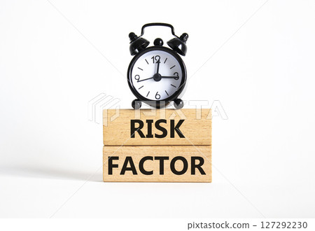 Risk Factor symbol. Wooden blocks with words Risk Factor Beautiful white background with alarm clock. Business and Risk Factor concept. Copy space. Risk Factor symbol. Wooden blocks with words Risk Factor Beautiful white background with alarm clock. Business and Risk Factor concept. Copy space. 127292230