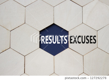 Results or Excuses symbol. Concept word Results or Excuses on wooden comb puzzle. Beautiful deep blue background. Business and Results or Excuses concept. Copy space 127292278