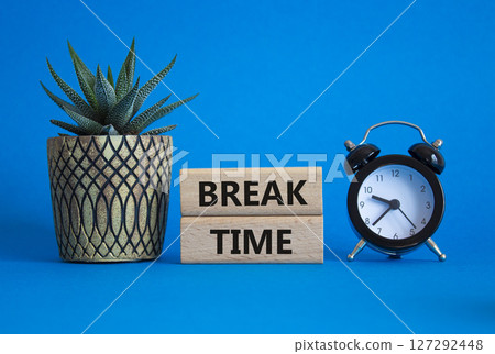 Break Time symbol. Wooden blocks with words Break Time. Beautiful blue background with alarm clock and succulent plant. Business and Break Time concept. Copy space. Break Time symbol. Wooden blocks with words Break Time. Beautiful blue background with alarm clock and succulent plant. Business and Break Time concept. Copy space. 127292448