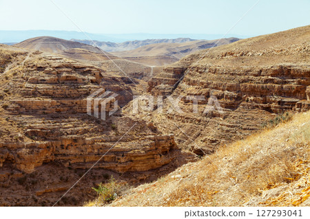 Stunning desert landscape with captivating layered rock formations Stunning desert landscape with captivating layered rock formations 127293041