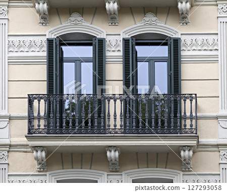 Ornate balconies on a historic building 127293058