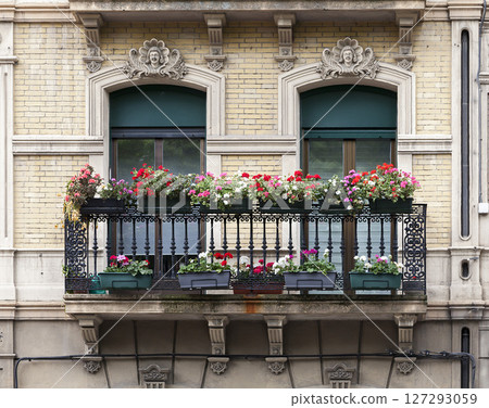 Ornate balconies on a historic building 127293059