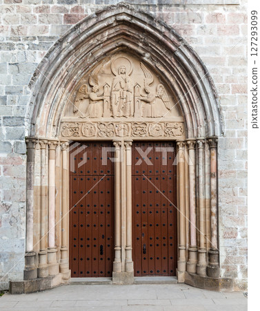 Discovering the carved entrance of a historic church in Roncesvalles along the Camino de Santiago 127293099